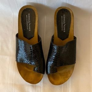 A pair of Donald Pliner shoes. Black and Tan size 8B